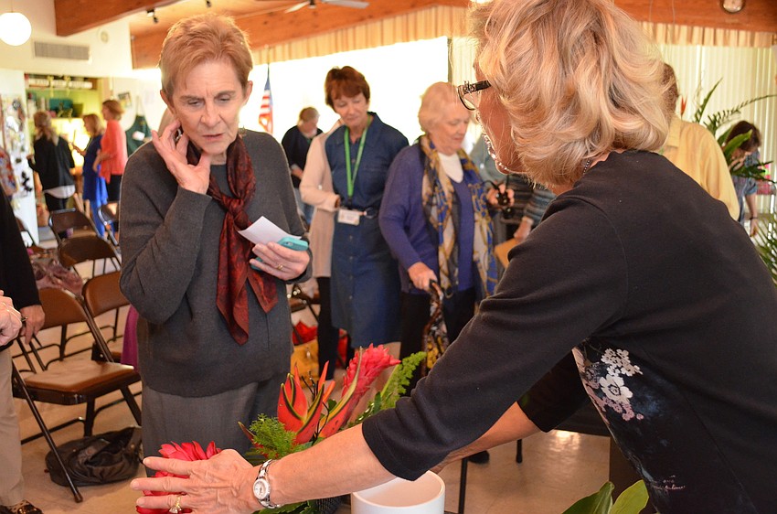 Emily Yaffe explains the elements in her floral design.