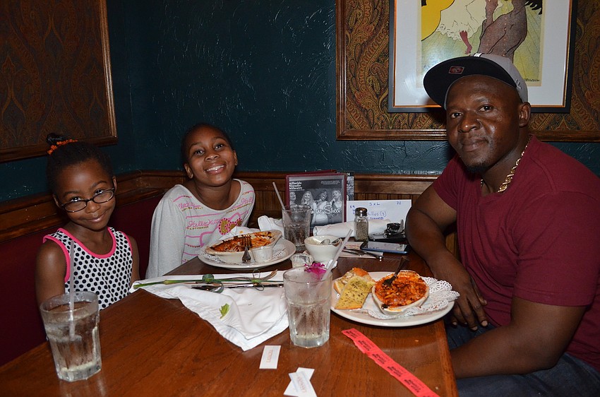 Chris Phillips with his daughters Maliyah and Azariah.