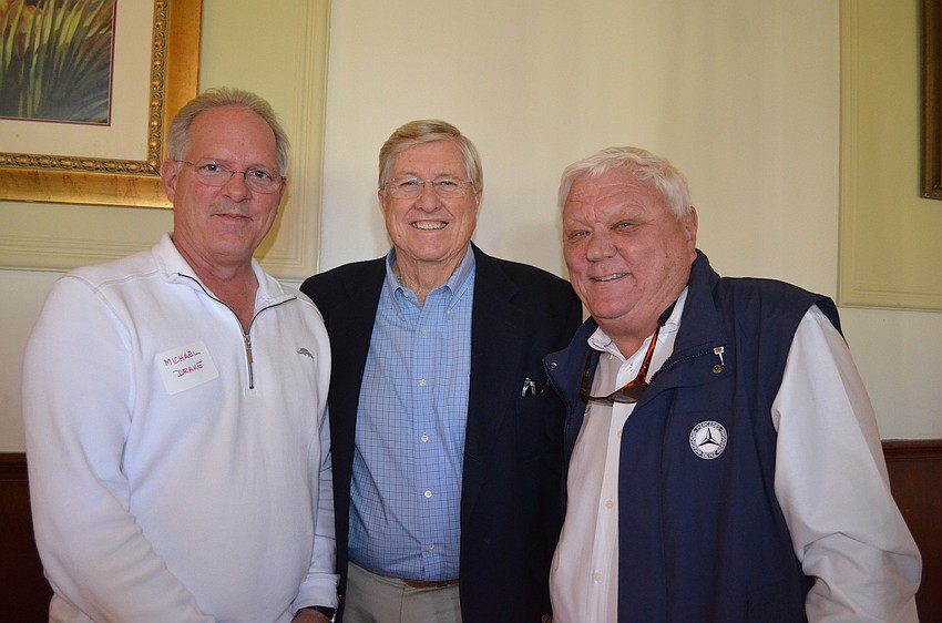 Michael Drake, of Property Solutions Group, Bob Gault and David Miller, of Cannons Marina