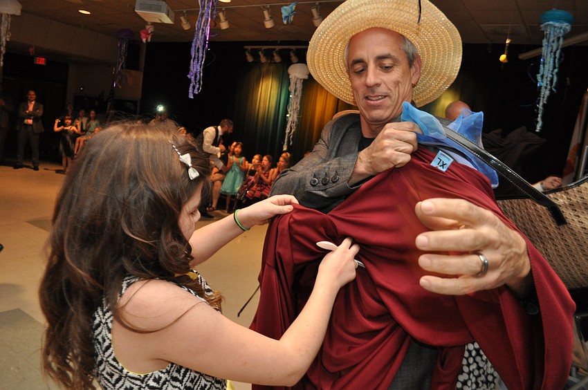 Randy Bezet, right, competes in the dress-up-your-dad contest with his daughter, Emily.