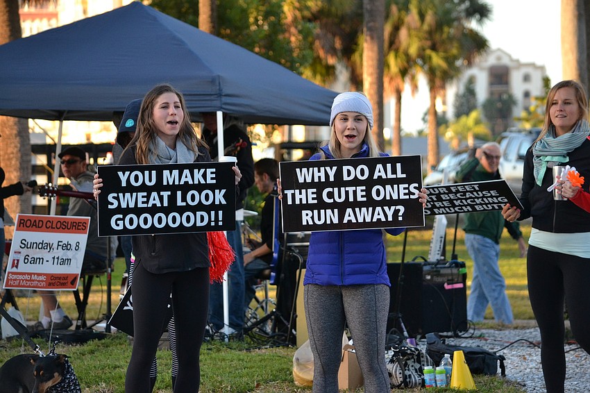 Morgan Taylor and Jilly Jaworske made signs to cheer on runners.