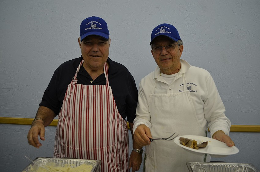 Leonardo Distefano and Joe Zampino serve dinner.