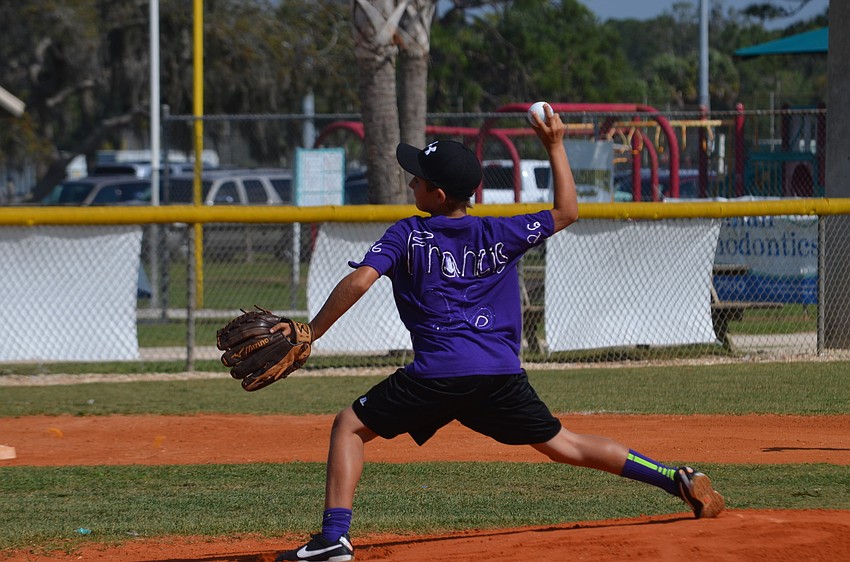 Carter Knight pitches.