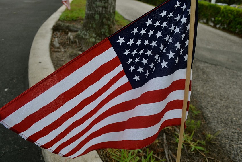 Veterans added the American flag to the Florida and Palm Aire flags already on display in the community.