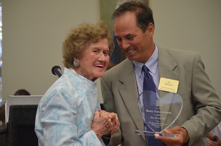 Betty Schoenbaum receives a special â€˜thank youâ€™ from Jay Berman.
