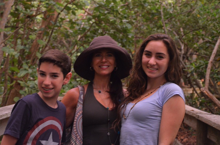 Ethan, Shara and Molly Cohen explore the mangrove trail.