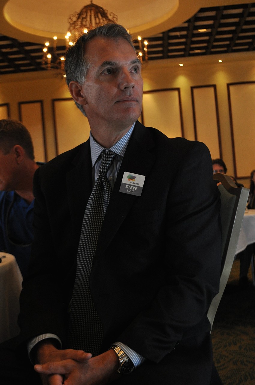 Alltrust's Steve Hall listens intently to the speaker.