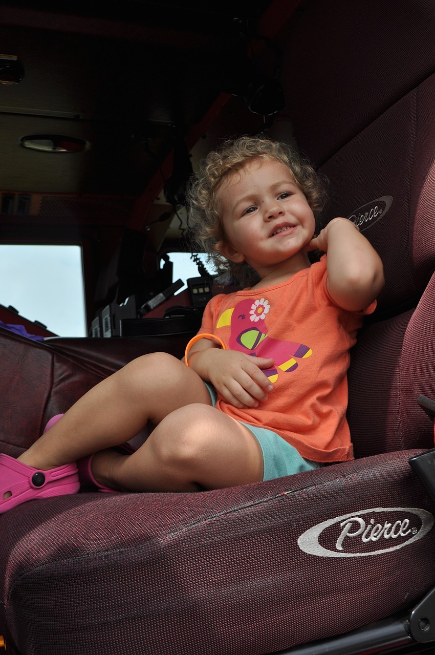 Ella Fuschetto checks out the inside of a fire engine.