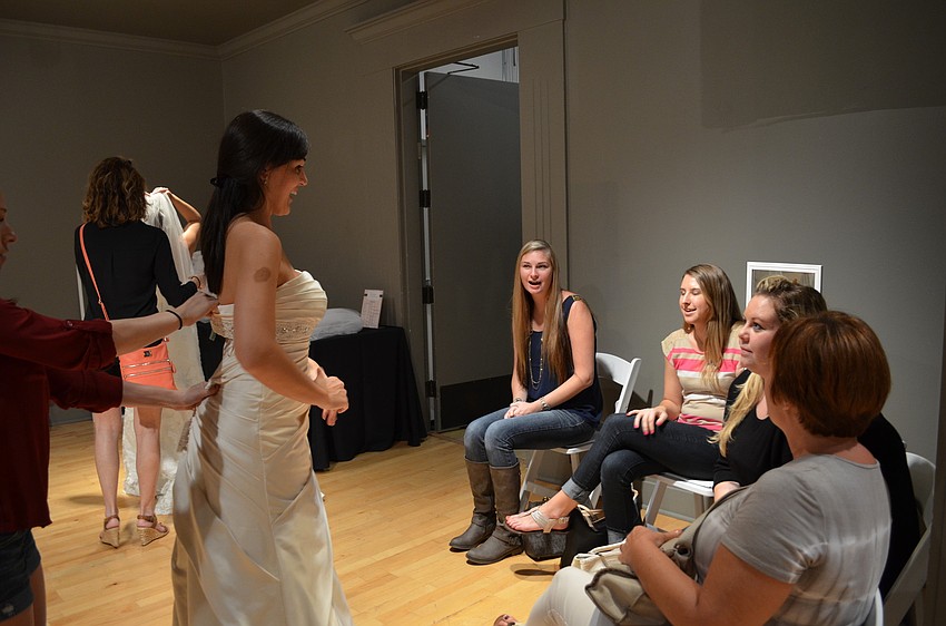 Bride Jessica Sweeney asks the opinions of friends and family on her gown.