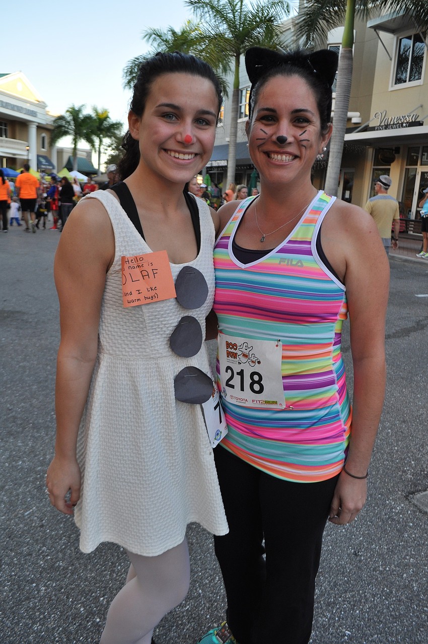 Anglea Gennecro, pictured with friend Aymara Haller, sports a tag that says, â€œHi! My name is Olaf and I like warm hugs.â€
