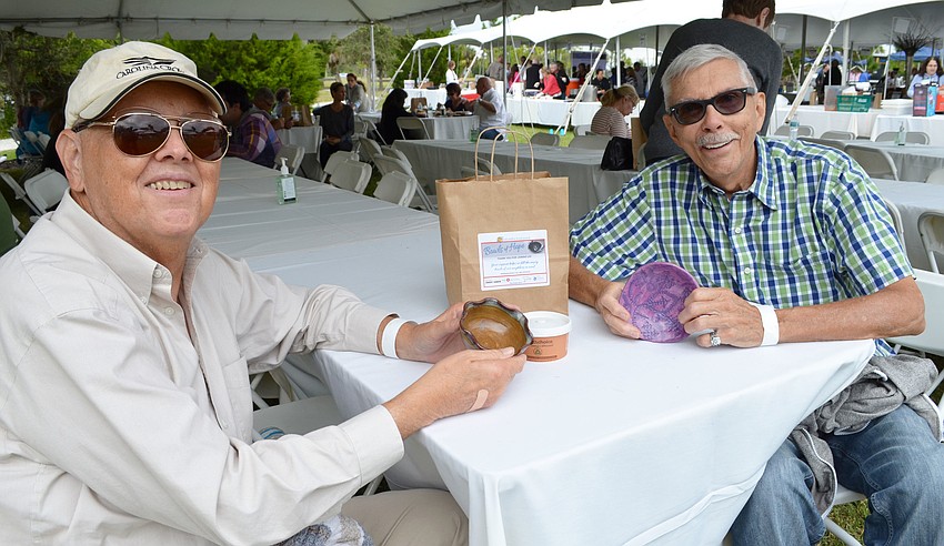 Jim Cross and Tom Lennox show off their bowls.