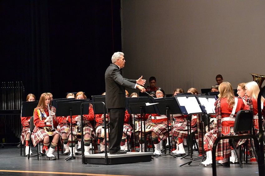 Spreen conducts the symphonic winds ensemble.