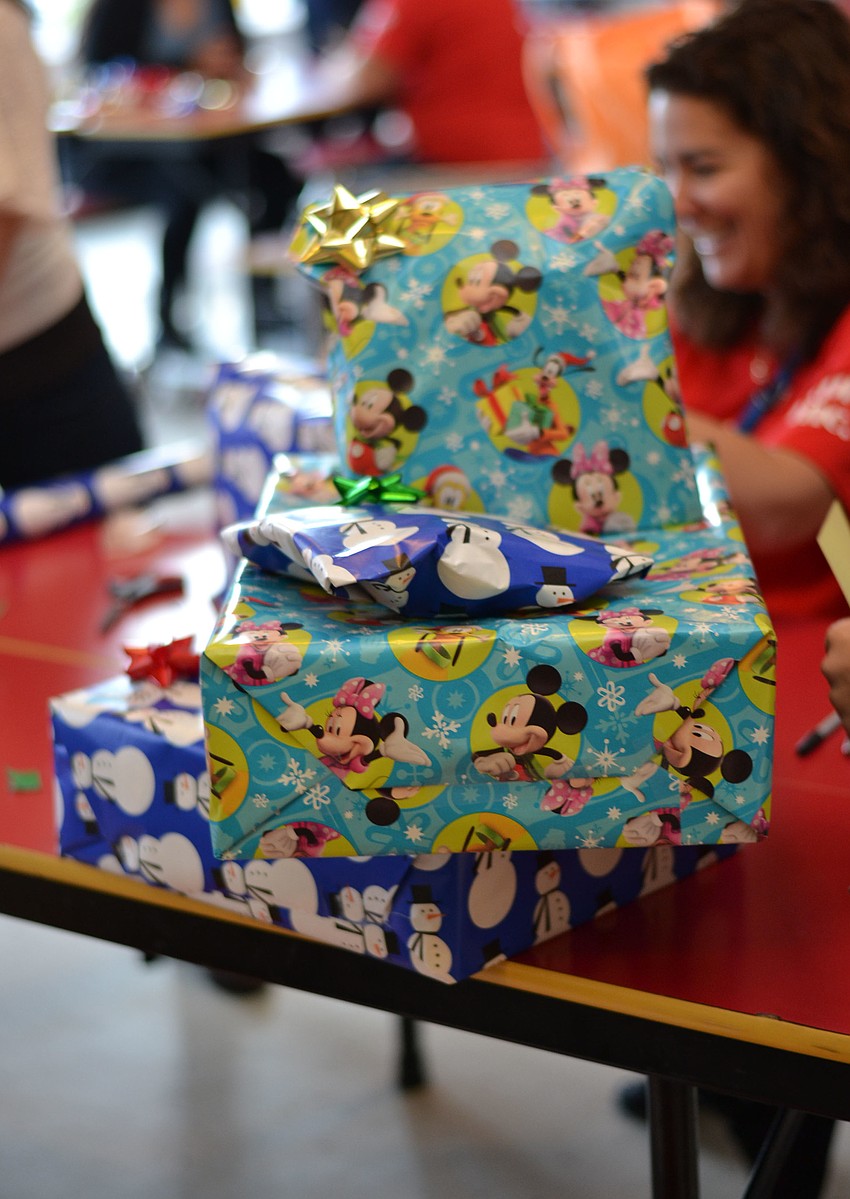 Parents picked up wrapped gifts to take home for the holidays.