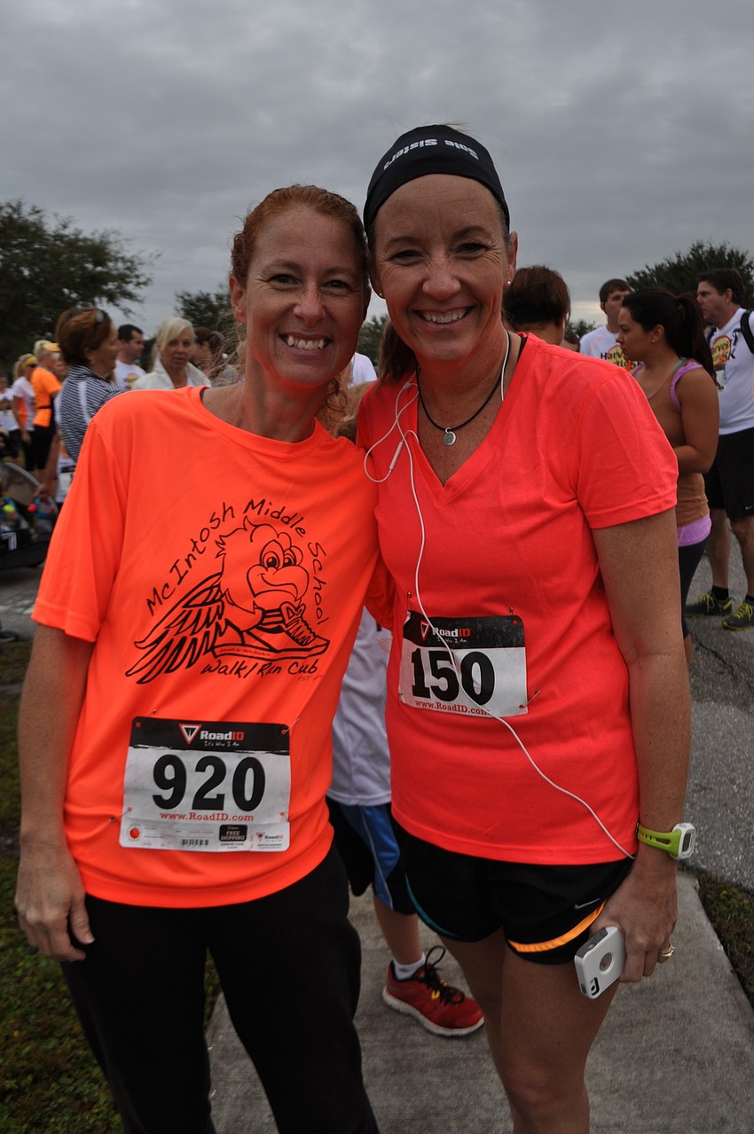 Sarah Scott runs with Kim Gibbens.