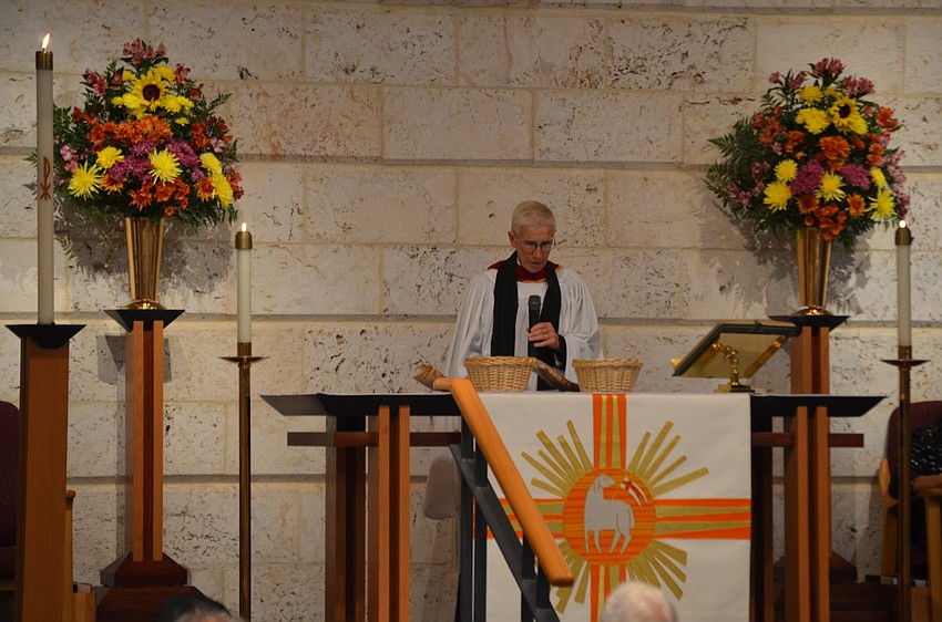 The Rev. David Danner, of All Angels by the Sea Episcopal Church, gives the offering prayer.