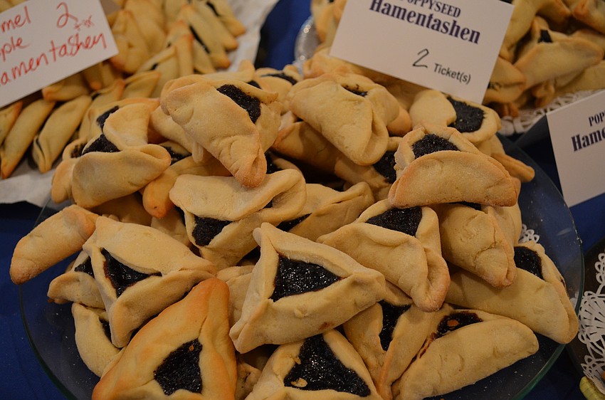 Baked goods including these poppy seed hamentashen.