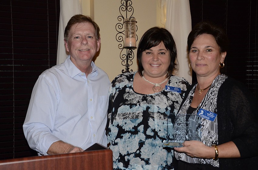 Mark Smith and Alana Tomasso presented Maria Bankemper, Best Western Gateway Plus, with the Large Business of the Year Award.