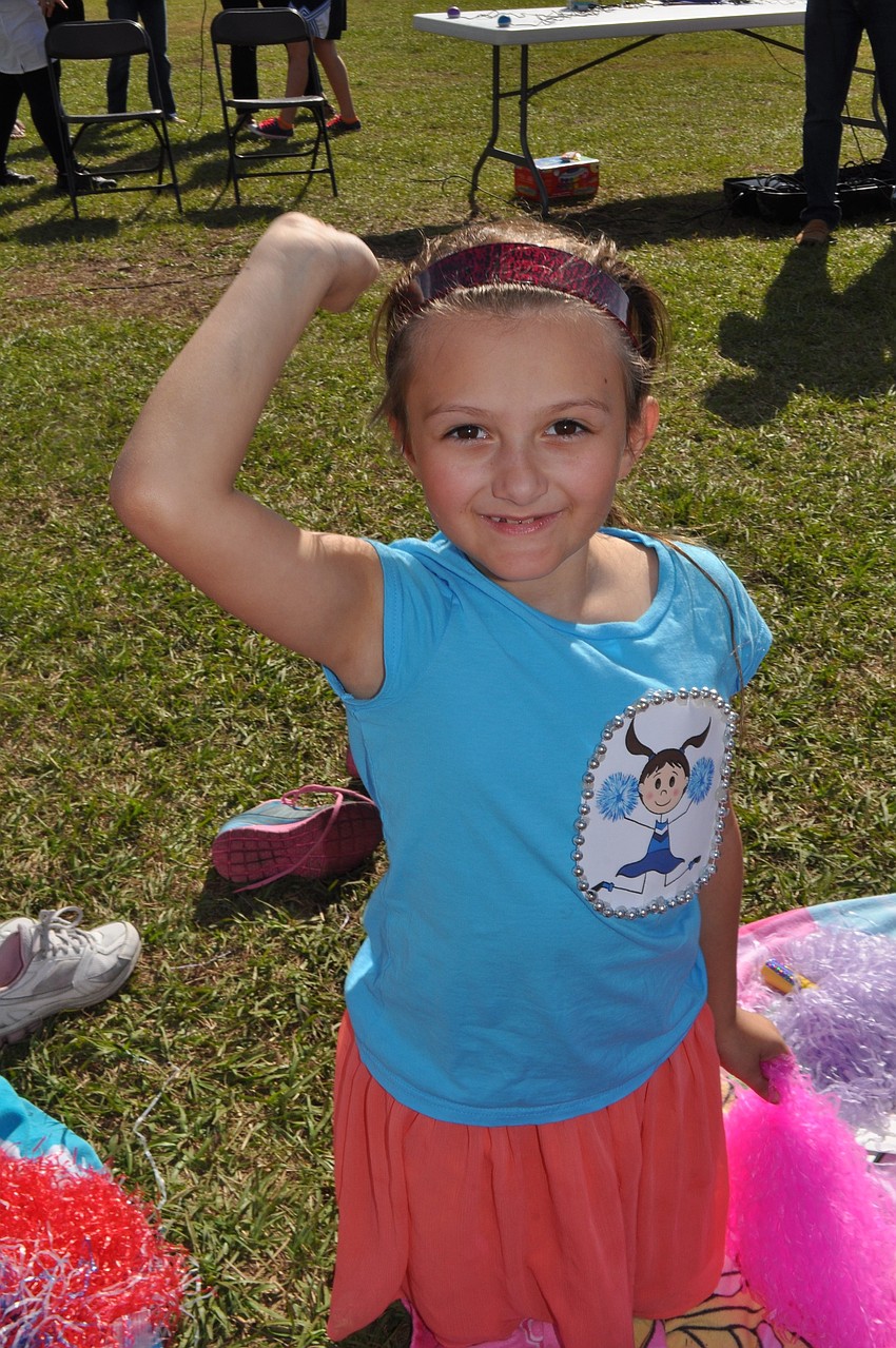 Rachel Dan, 9, pretends to be a wizard during a game.