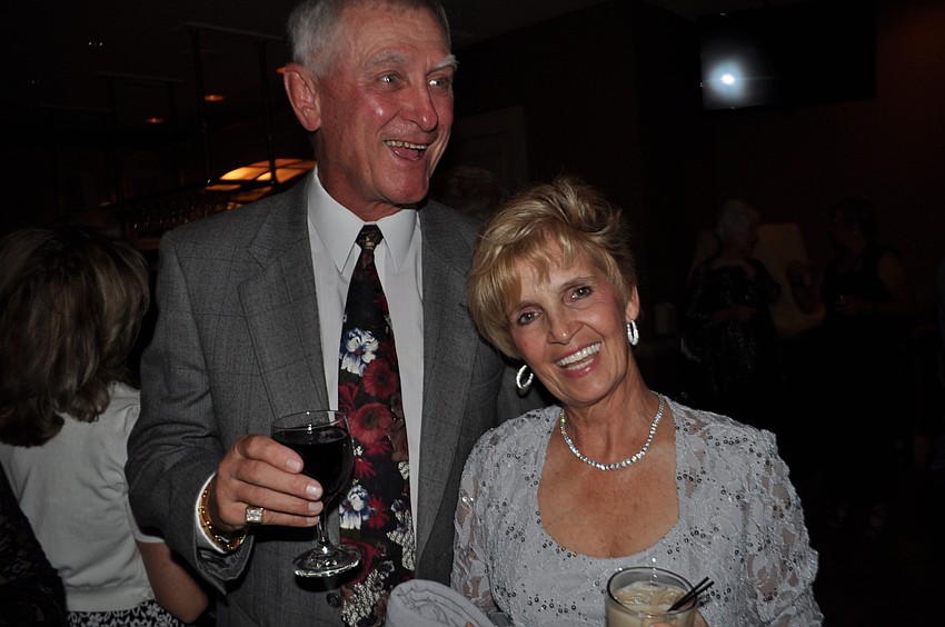 Ken and Darlene Hoffman laugh with friends.