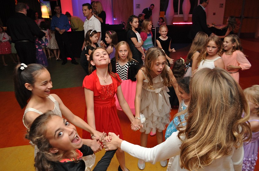 Josie Colby, in black, dances with her friends.