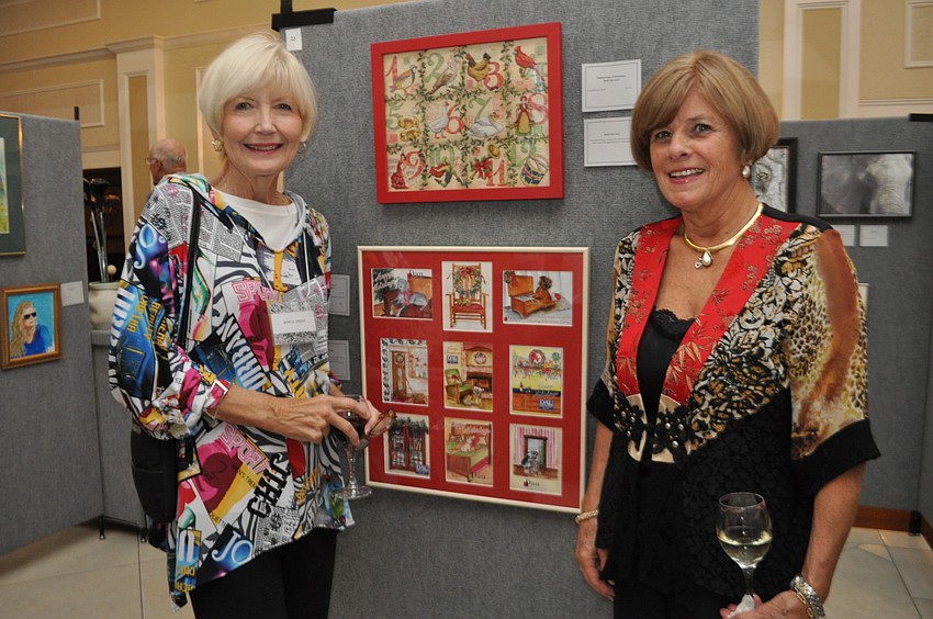 Marcia Knight explains her piece, â€œStickley Invitations,â€ to fellow artist June Paton. The