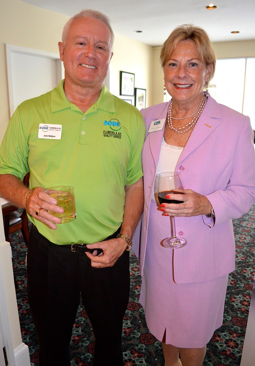 John Wojtyna, Aqua Plumbing and Air, and Gail Loefgren, Longboat Key Chamber of Commerce
