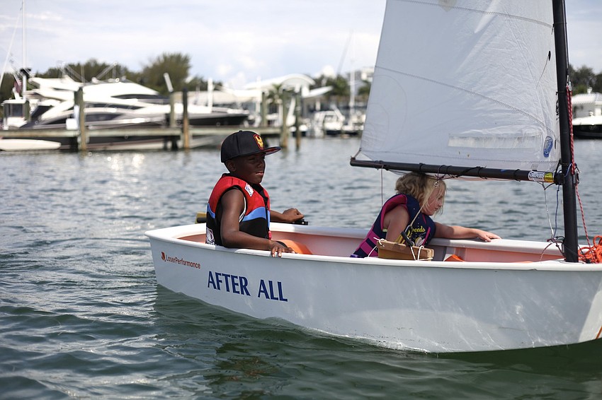 JaHeim Hodo, 10, and Maya Berger, 7, team up for the day.