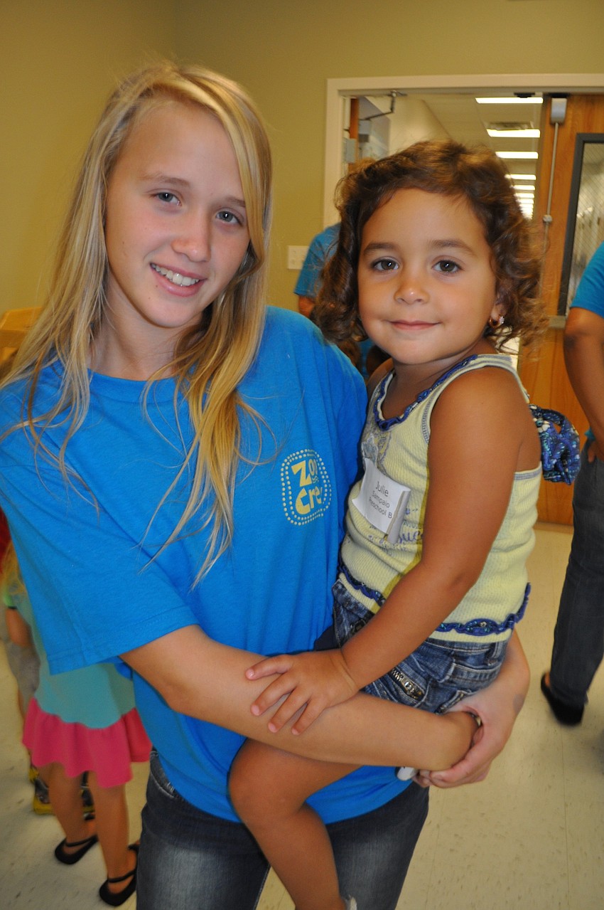 Danielle Kendall gives a ride to Julie Sampaio, 3.