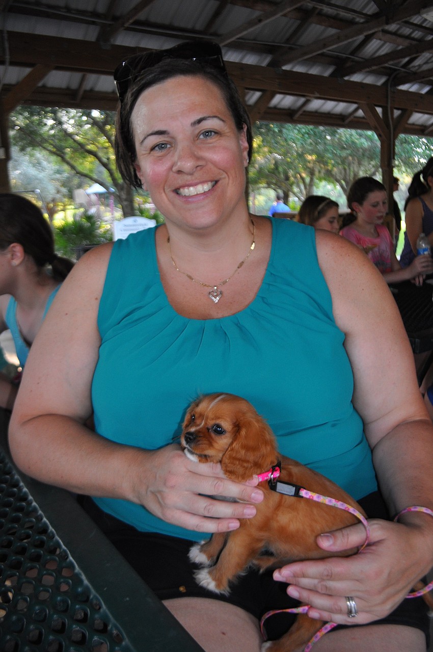 Amy Meese and her family bring their 11-week-old puppy.