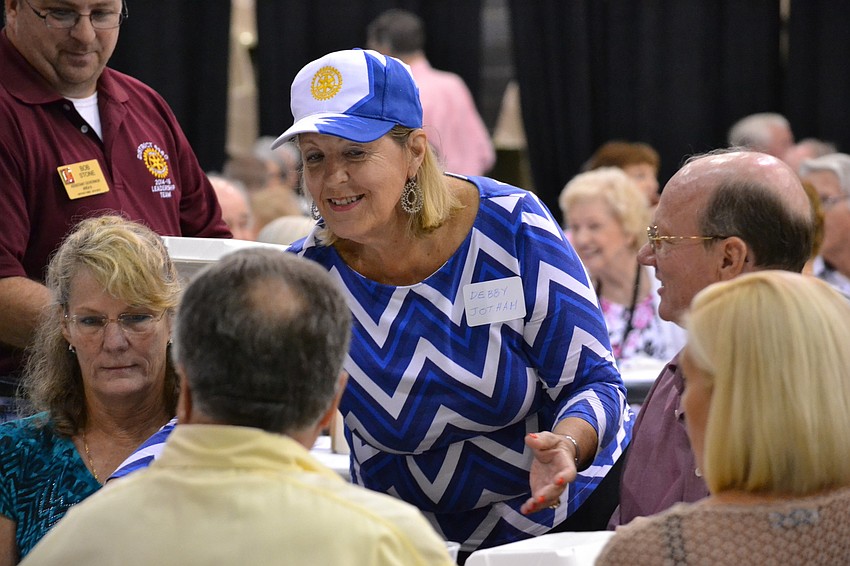 Debby Jotham helps hand out meals at the Pioneer Day Picnic.