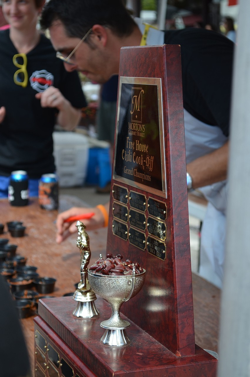 The City of North Port Fire Rescue proudly displays a returning champions trophy. The North Port Fire Rescue team took home 1st place last year for the chili cook off.