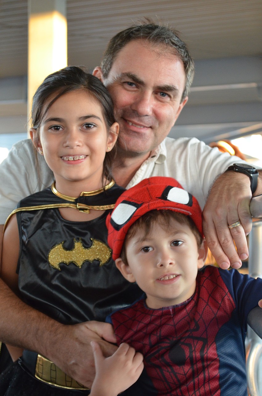 Sergio, Valentina and Luca Sanseverino enjoy an evening at the Mote Marine Laboratory and Aquarium.