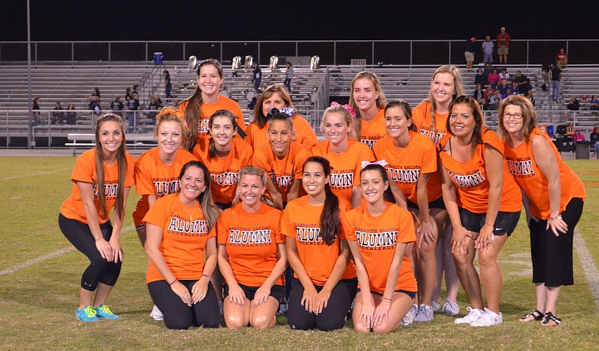 Sarasota High School Alumni Cheerleaders pose on the field during halftime.