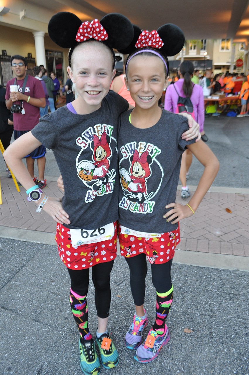 Anna Stock and Amelia Skoumal, students at Nolan Middle School, prepare for the 5K.