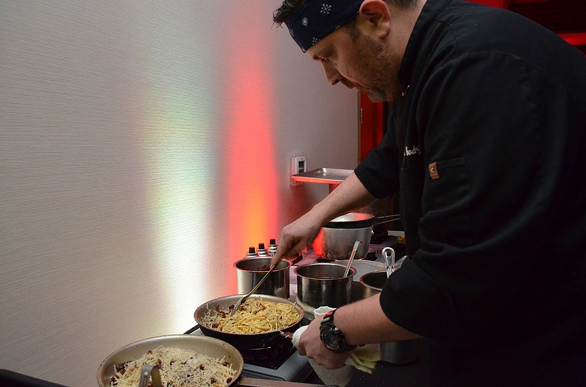 MADE Executive Chef Mark Woodruff prepares the entrÃ©e for the Art of Food Festival.