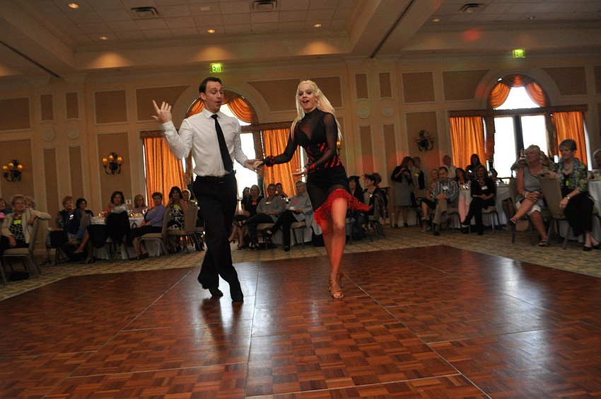 Maks Lototskyy and Sarah Haworth perform with Dynasty Dance Sarasota.