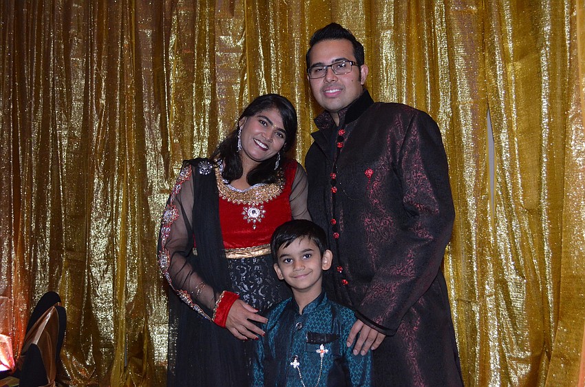 Priya and Pram Ojha with their son Om.