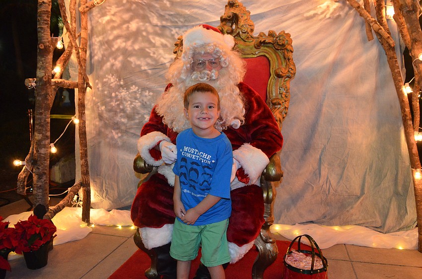 Joshua Gursky, 5, poses with Santa.