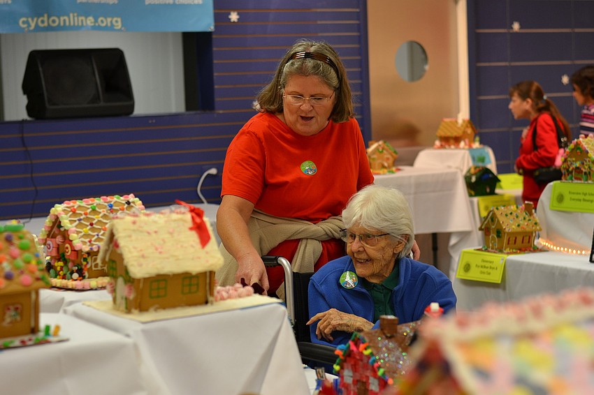 Mildred Turnbull and Shelly Yamrick admire the gingerbread houses.
