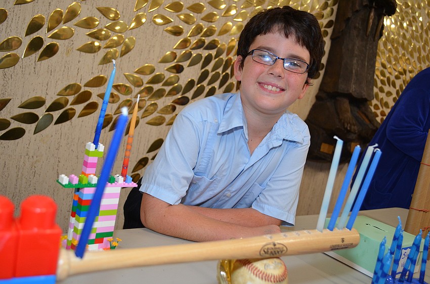 Garrett Pearson spent three hours making his menorah out of a miniature baseball bat.