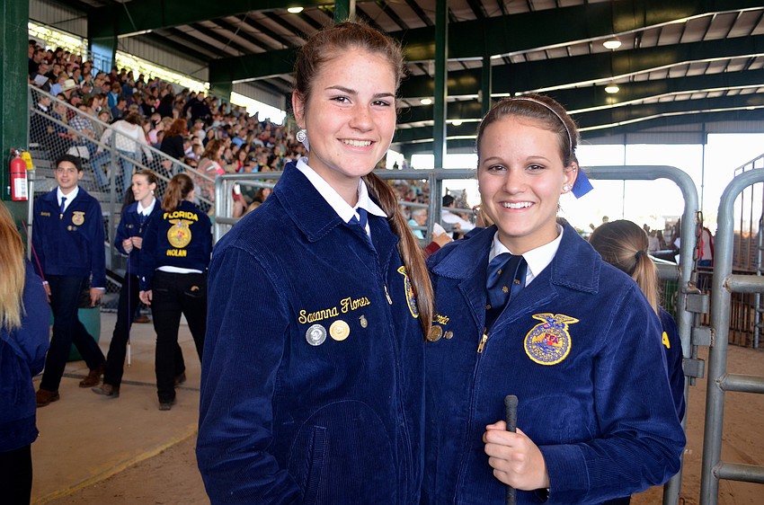 Lakewood Ranch High students Savanna Flores and Victoria Pointon sold pigs at the fair.