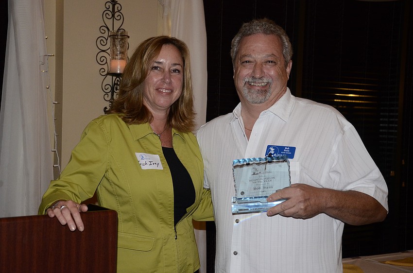 Trish Ivey presented Bob Stein, Island Visitor Publishing, with the Business Person of the Year Award.