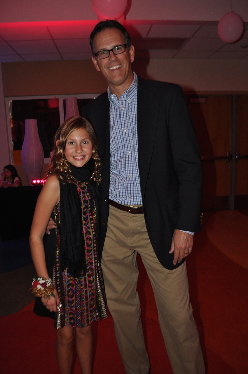 Caroline Pope, a fifth grader, enjoys her last father-daughter dance with her dad, Robert.