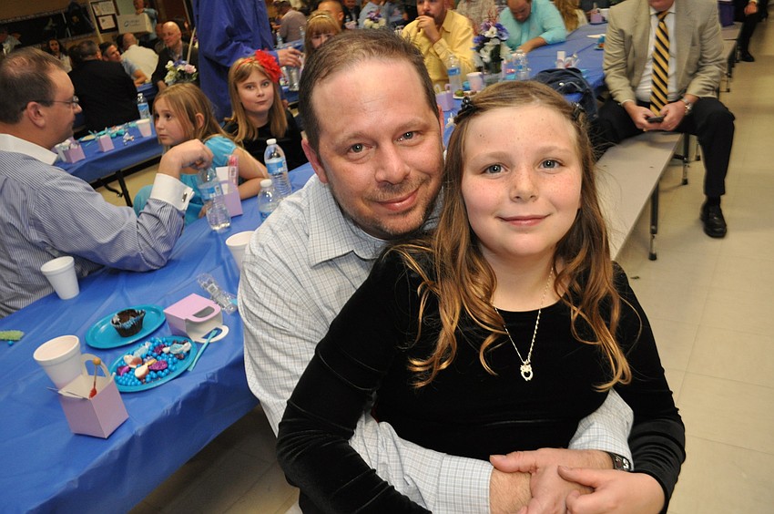 Doug and Peyton Dingham get something to eat.