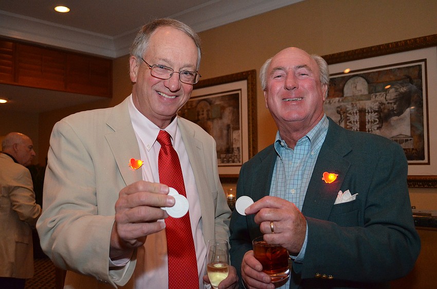 Tom Smith and Thom Coyne show off their chips.