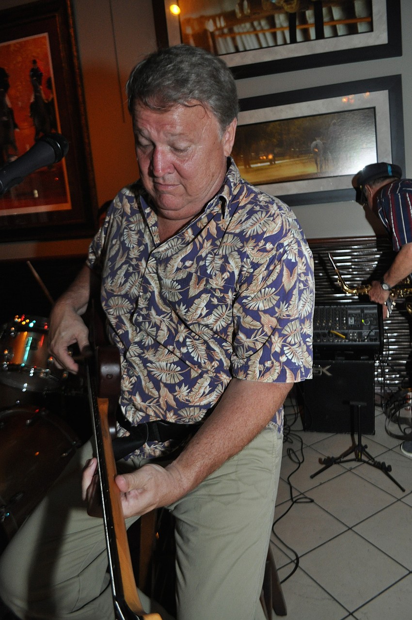 Gumbo Boogie Band bassist Steve Page strums for the crowd.