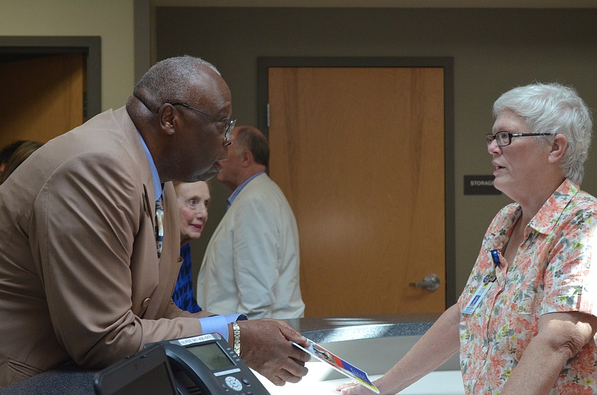 Mayor Willie Shaw learns more about the center from nurse Heather Campbell.