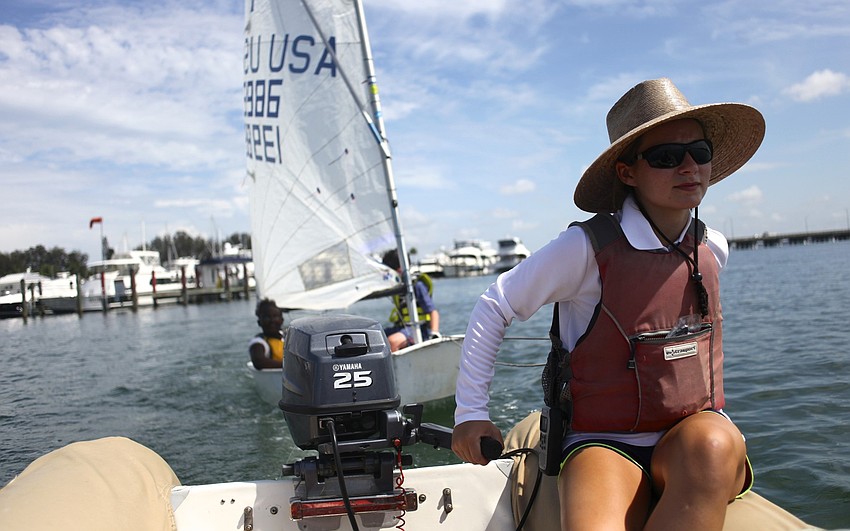 Instructor Katie Freeley tows a boat that was lagging behind due to lack of wind.
