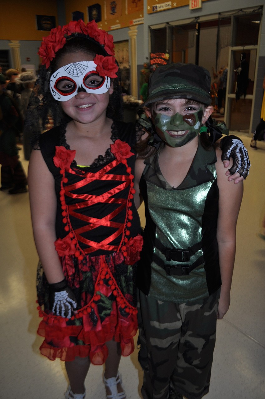 Alana Caballero dresses up as Day of Dead, while Erin Galvin goes Army.