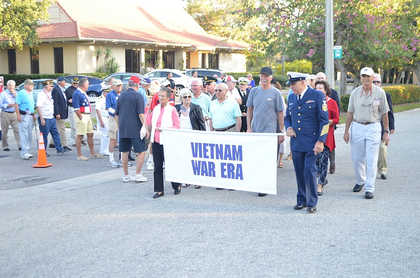 Vietnam War era veterans march in the parade.